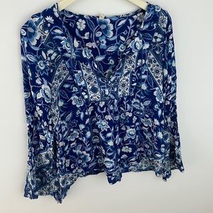 Spell floral blouse. Size large, runs small- I would say a size small/medium.